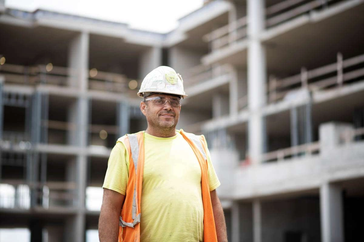 A worker in front of the new building. © robert lowdon