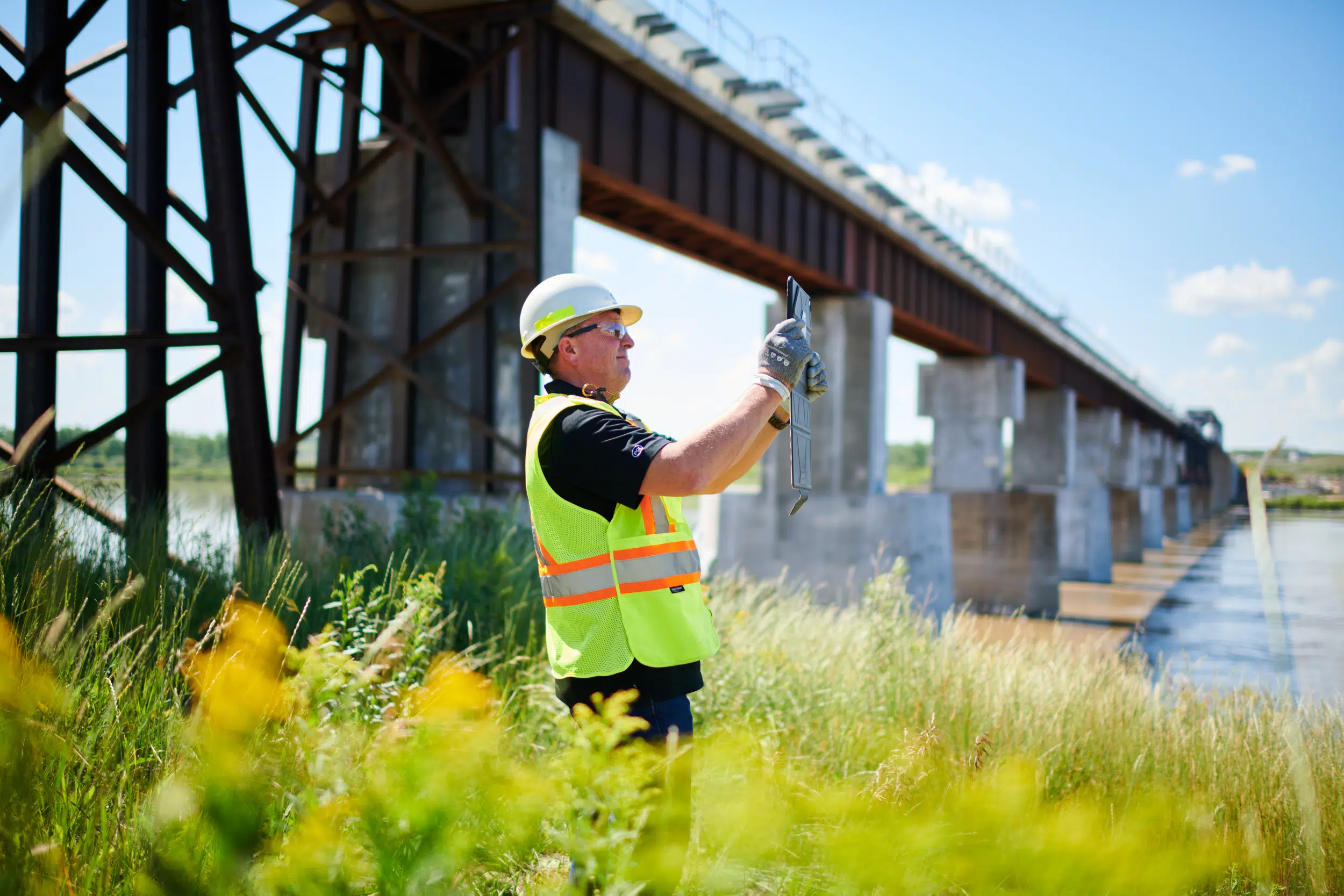 construction worker uses tablet for images