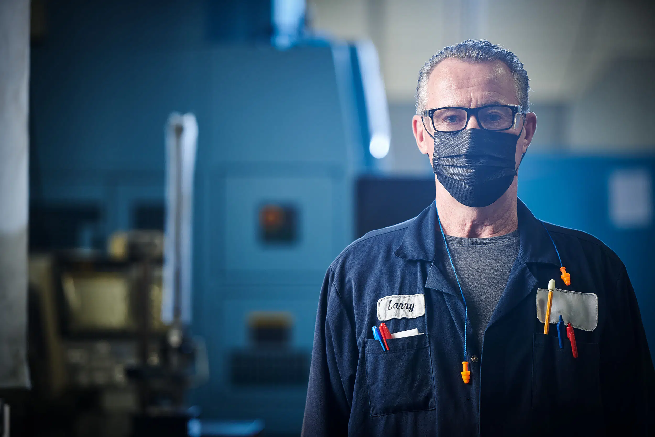 A dynamic image of a worker in a factory.