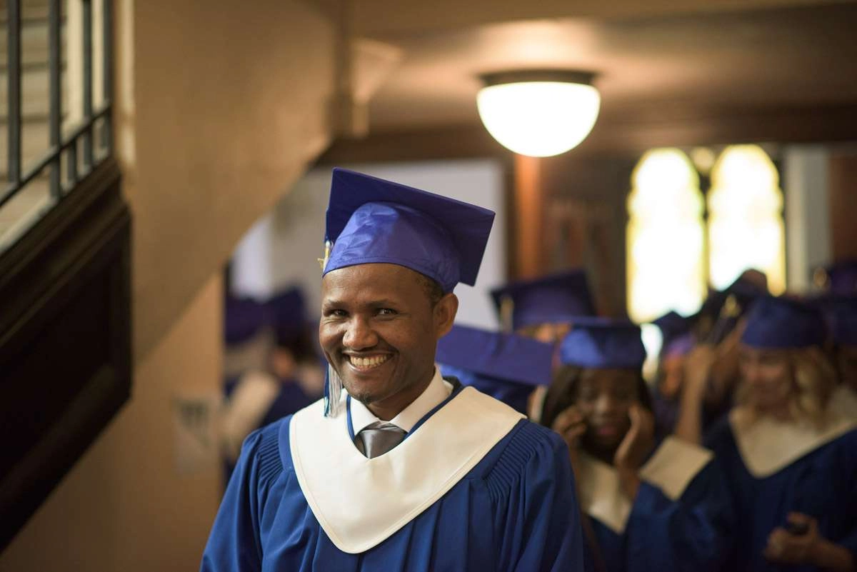 This medium close-up shot focuses on a graduate’s facial expression. Photographs of individual students help to illustrate the personalized experience offered to cdi students.