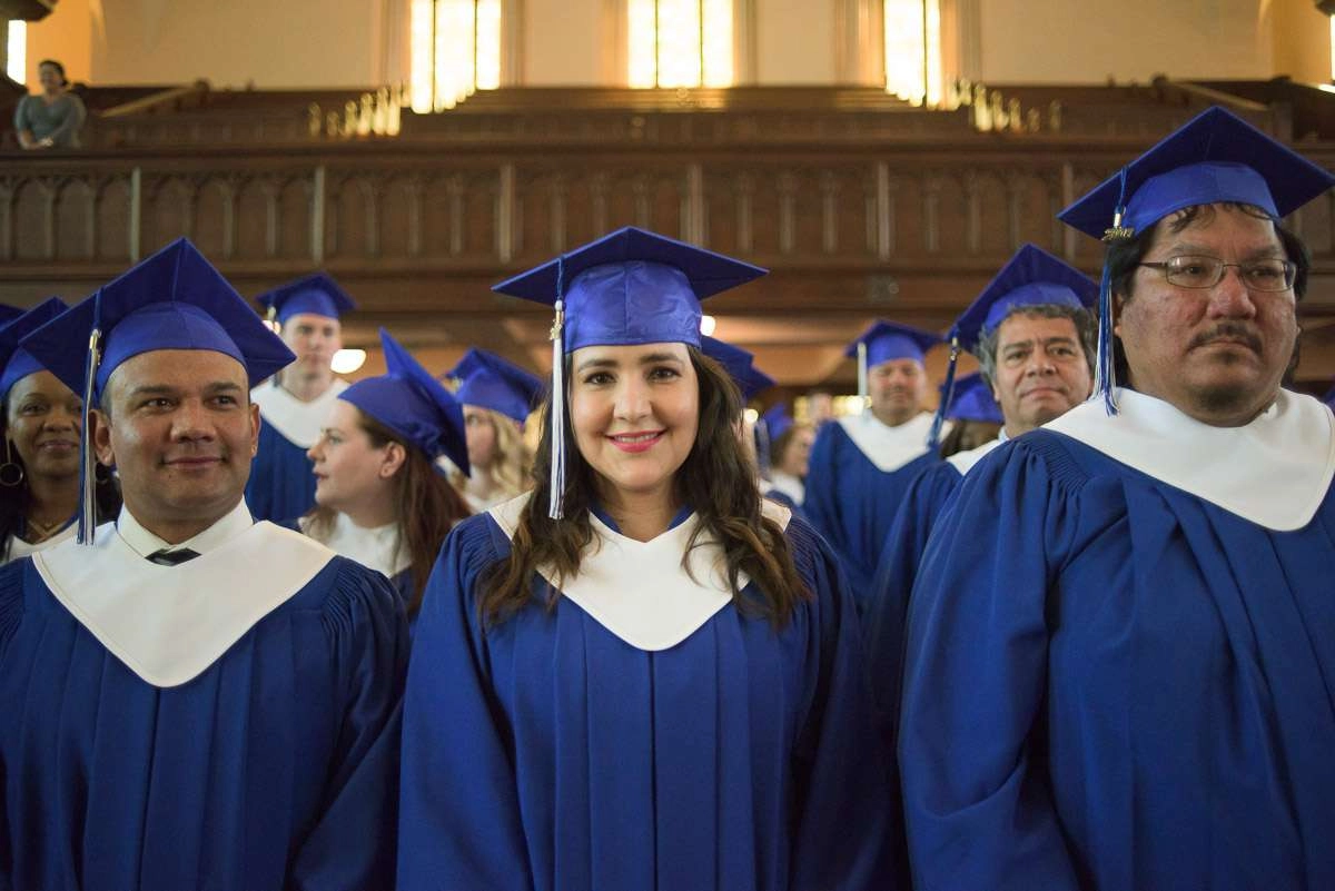 The students are front and centre in this medium close-up shot captured during the graduation ceremony.