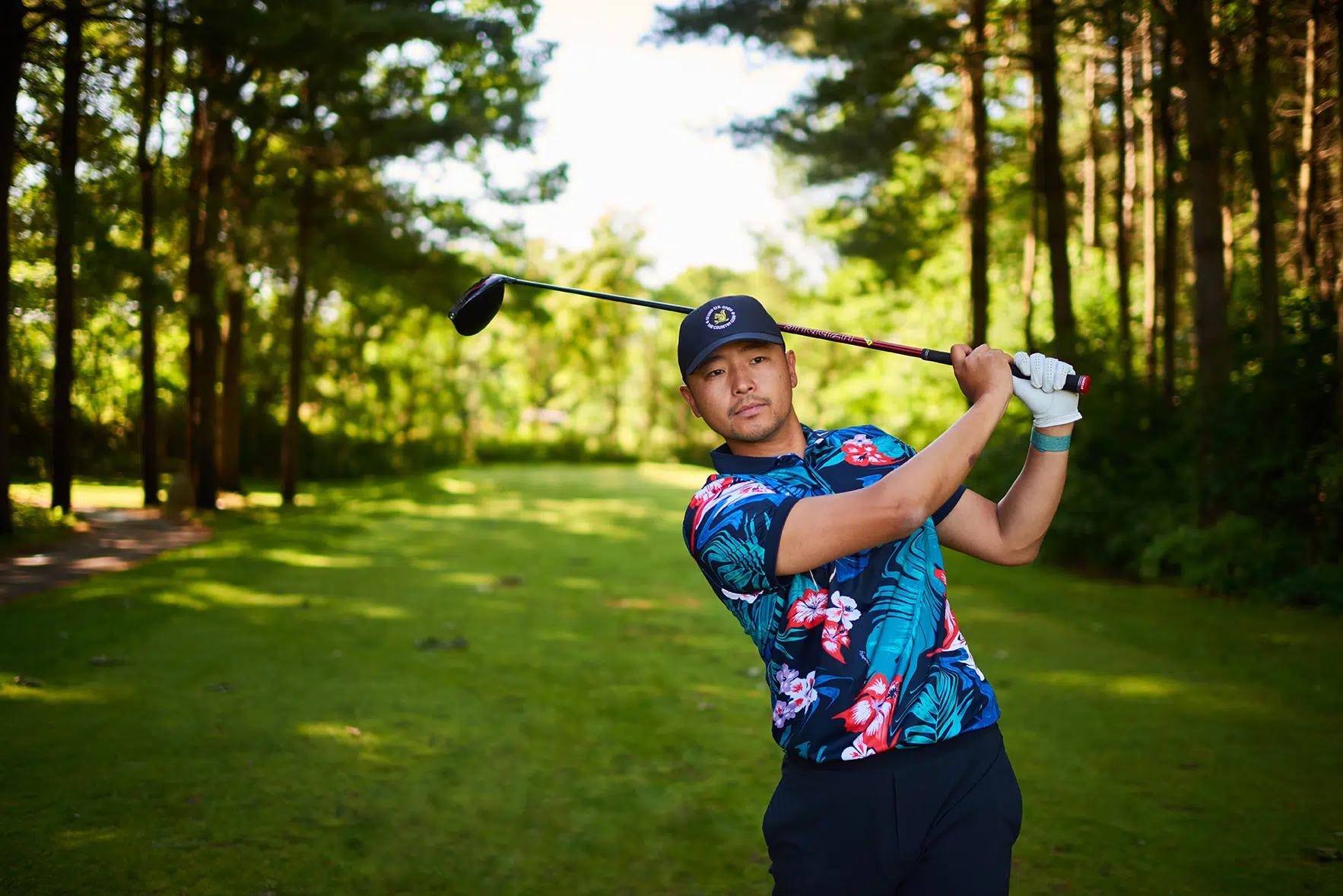 A golfer admires his drive after the swing