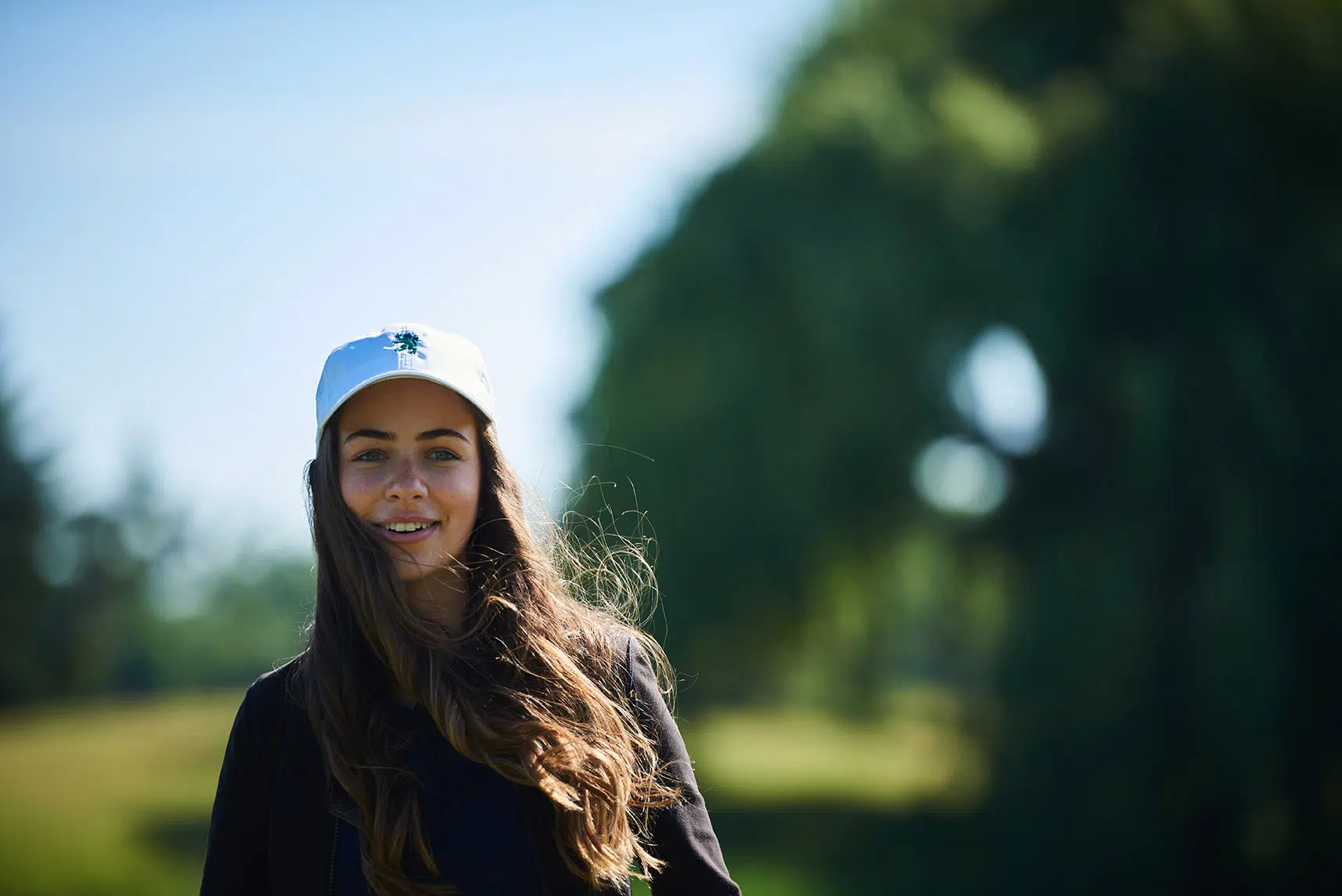 Close up candid shot of young female golfer