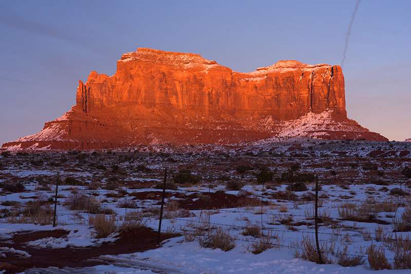 Blog - Photographer Website Golden sunlight washes across a butte in colorado