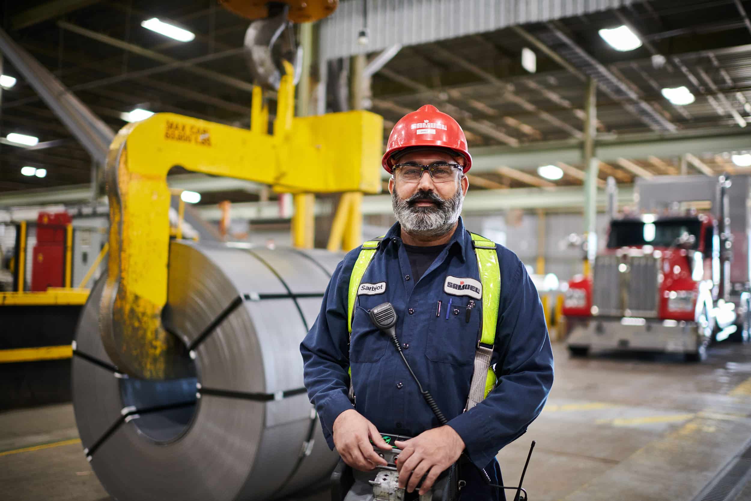 A crane operator at a steel processing factory.