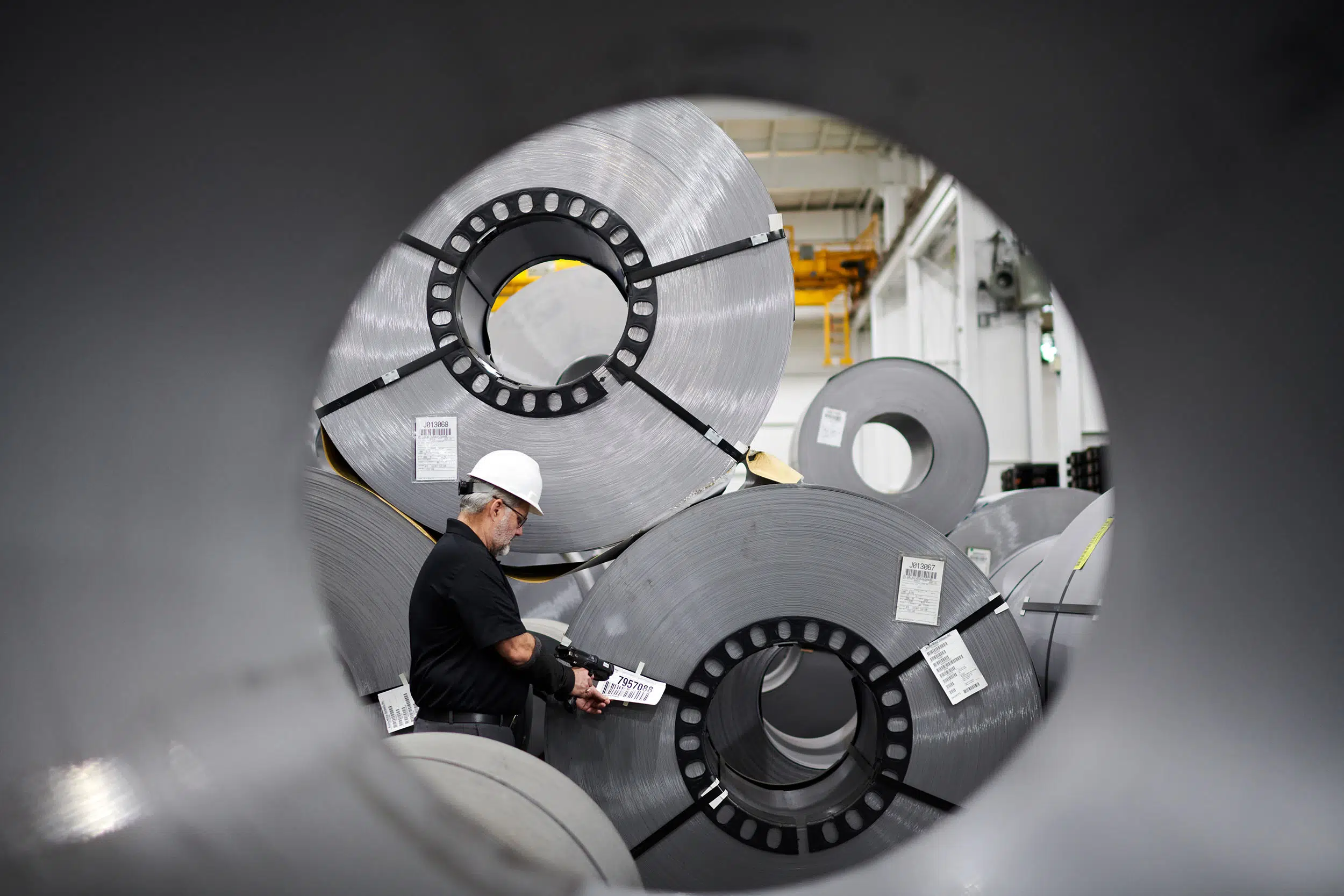 A worker scans a product for inventory.
