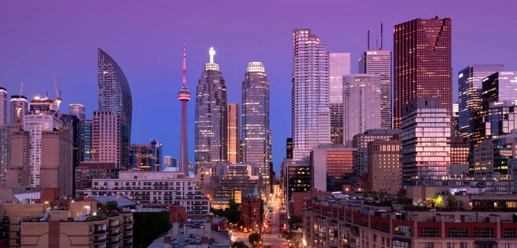 Downtown toronto skyline with tall building at early dawn night
